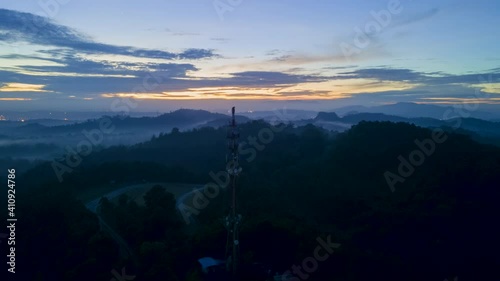 4K UHD ProRes 422 Aerial Hyperlapse Footage of Communication tower during morning sunrise with clouds, mists and fog
