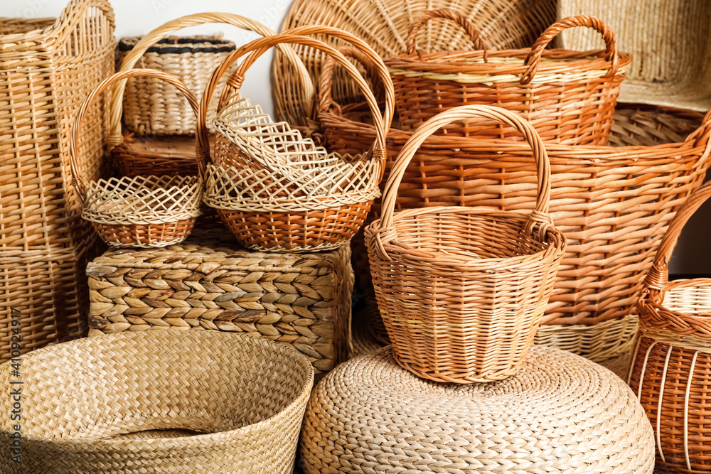 Many different wicker baskets made of natural material as background, closeup Many different wicker baskets made of natural material as background, closeup