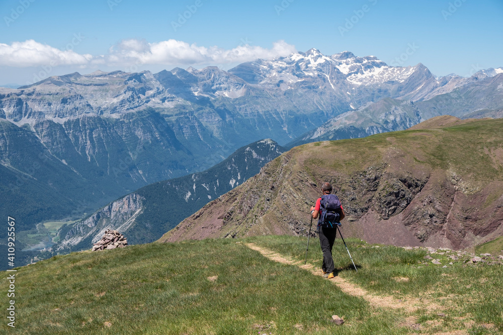 trekker at route of ascent to Punta Suelza whit Pineta Peaks, 2972 meters, Huesca, Spain