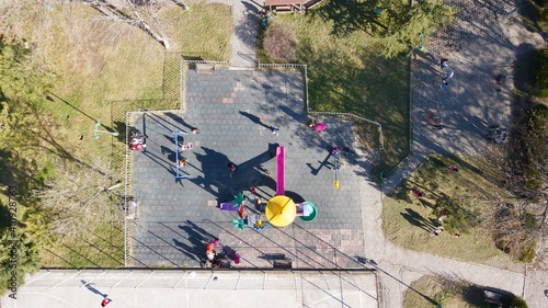 aerial view of children playground. kids are playing game at the sunset.