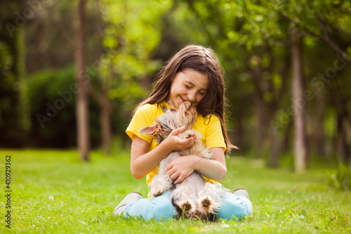 the little girl delighted with the little dog