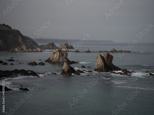 Rock formation sea stack at Playa del Silencio Gavieiro beach ocean coast shore cliffs Castaneras Asturias Spain Europe photo