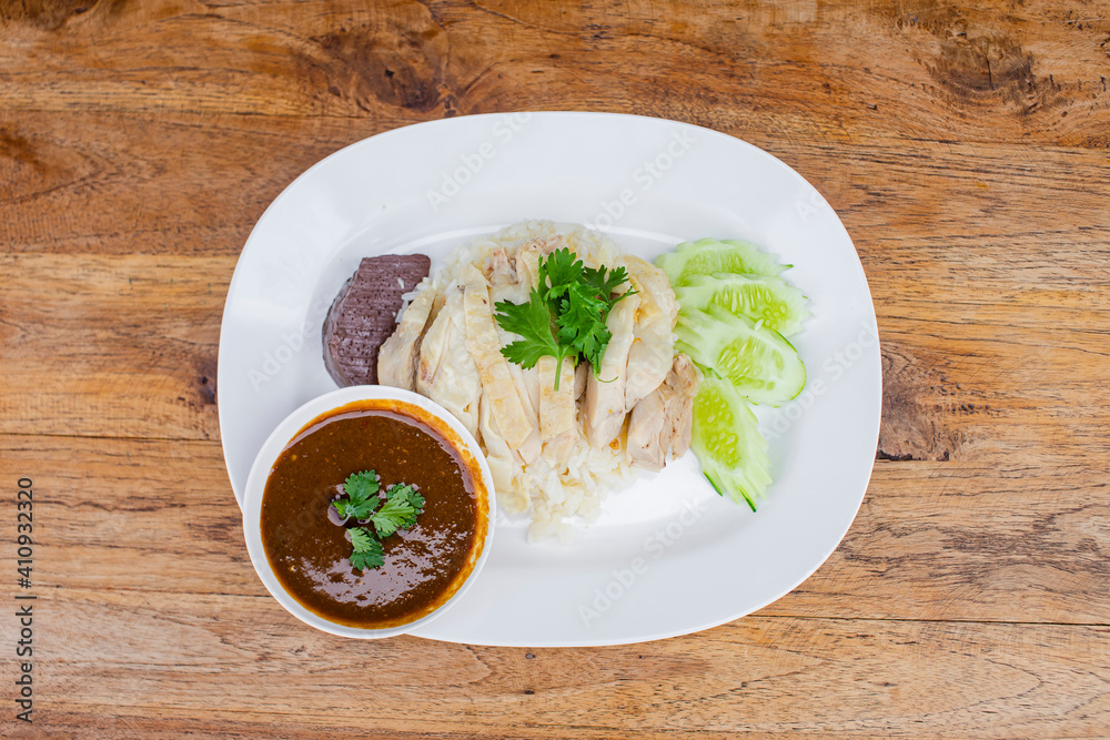 boiled chicken with rice on a white plate boiled chicken with rice on a white plate