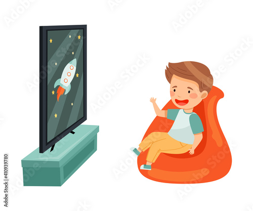 Little Boy Sitting in Armchair Watching Cartoon Film on TV Vector Illustration