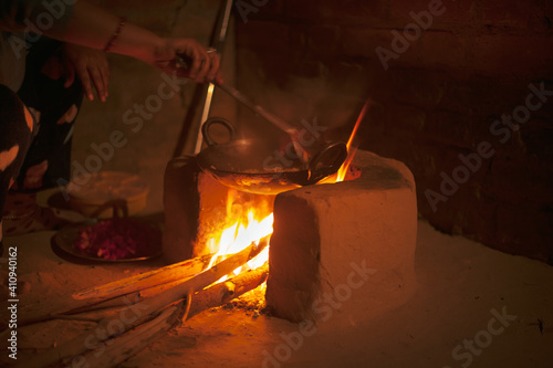 Photos An earthen stove with wooden fire in a village.