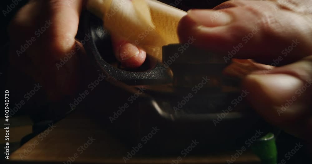 Cinematic macro of master artisan luthier working on creation of handmade fine quality wood violin in creative workshop. Concept of spiritual instrument, handmade, art, orchestra, artisan, music. Cinematic macro of master artisan luthier working on creation of handmade fine quality wood violin in creative workshop. Concept of spiritual instrument, handmade, art, orchestra, artisan, music.