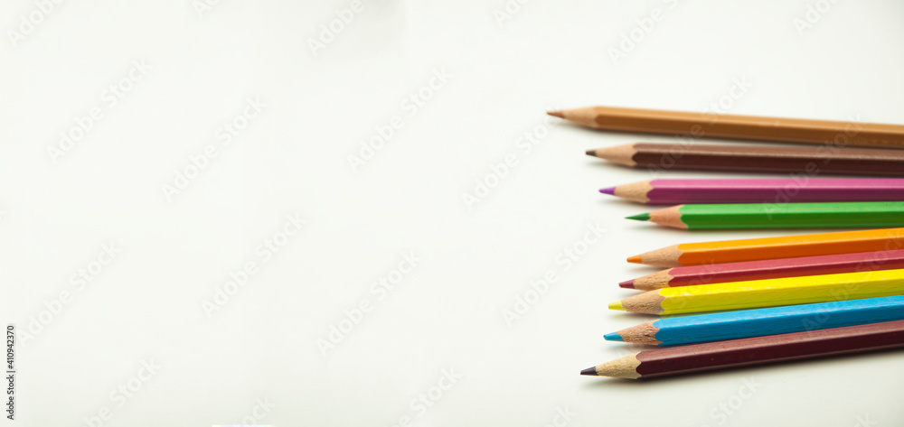 Fototapeta premium colored pencils on a white background. education concept. illustration of training.