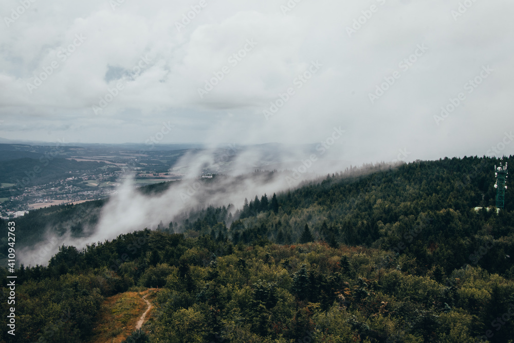 Evaporation of water from forests in northern Bohemia. Flowing fog at the top of Ještěd. Temperature change. Strong winds cause water droplets to evaporate and mist to form. lungs of the Czech healthy