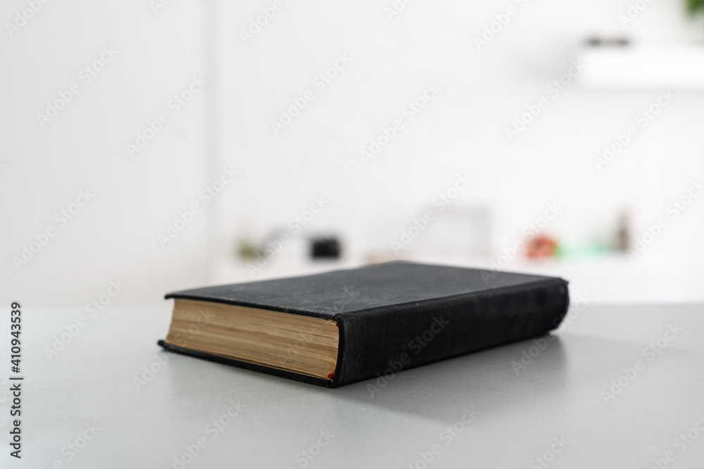 Holy Bible Closeup. Holy Bible on the Small Aged Wooden Table Holy Bible Closeup. Holy Bible on the Small Aged Wooden Table