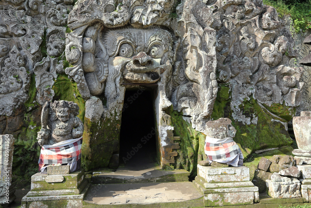 Carvings at entrance to cave in ancient Hindu temple in Bali Stock ...