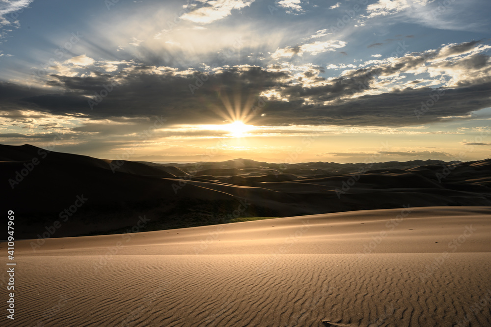 Sunburst Over Layers of Sand Dunes