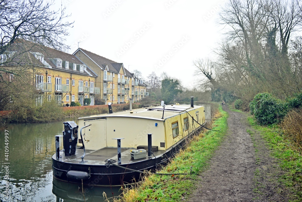 Fototapeta premium Canal boat in river during winter