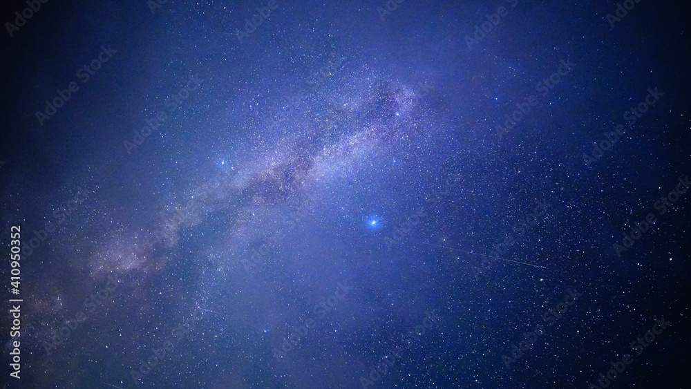 Fototapeta premium Milky Way with two bright stars, shooting stars