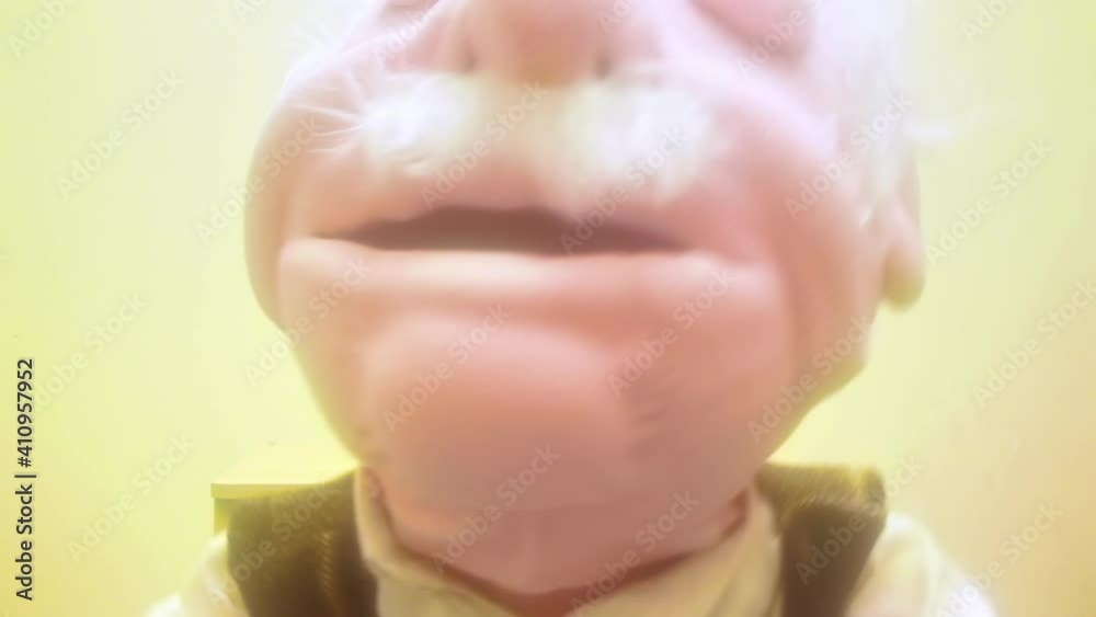 Strong glow: a puppeteer working with his puppet (looking like an old man).
Strong glow: a puppeteer working with his puppet (looking like an old man).