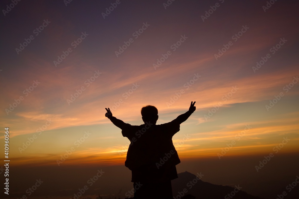 silhouette of person with arms outstretched silhouette of person with arms outstretched
