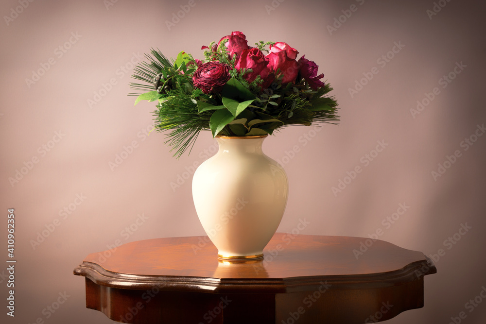 Bouquet of flowers in a vase on antique