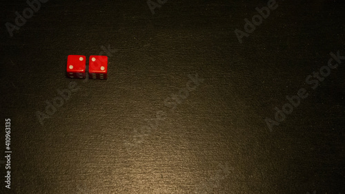 Dice combination on a black wooden surface