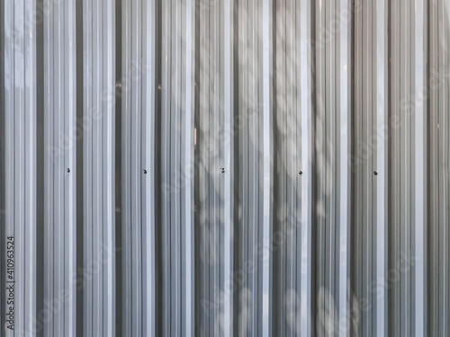 Full Frame White Corrugated Metal Wall Background with Light and Shade