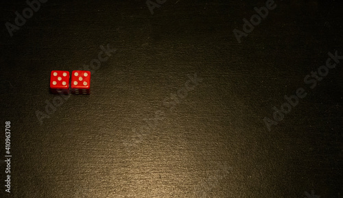 Dice combination on a black wooden surface
