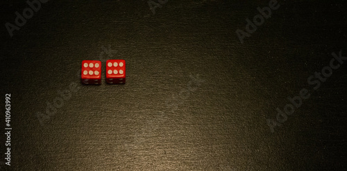 Dice combination on a black wooden surface