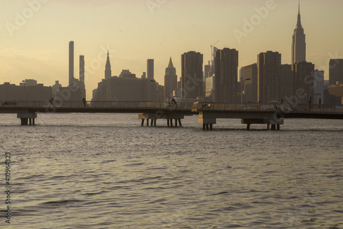 New York cityscape at sunset, view from Transmitter Park in Greenpoint, Brooklyn photo
