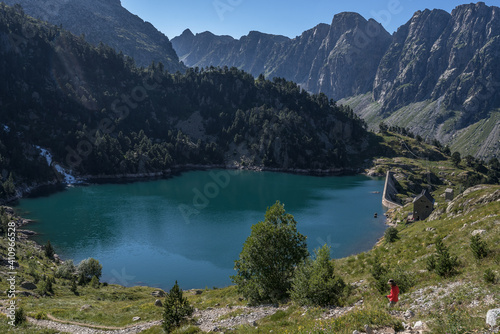 View of Era Restanca glacial lake before the last descent stretch to Restanca refuge, Aiguestortes & Estany de Sant Maurici National Park, Pyrenees, Spain.