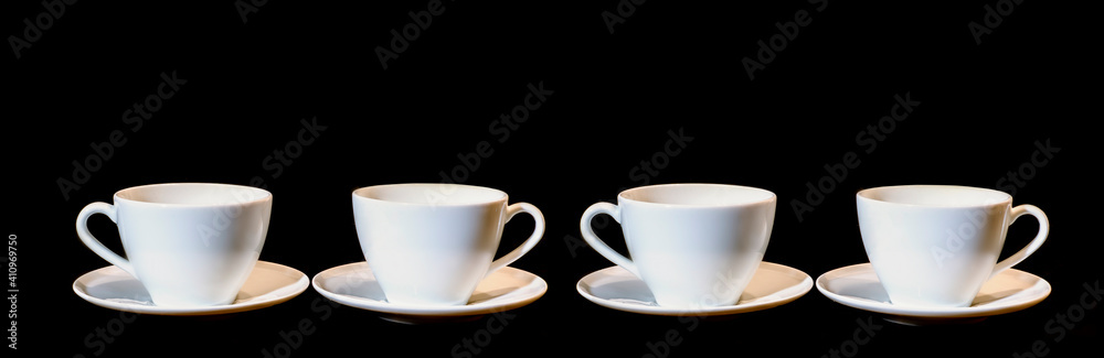 banner on a black background with four ceramic cups arranged in a row banner on a black background with four ceramic cups arranged in a row