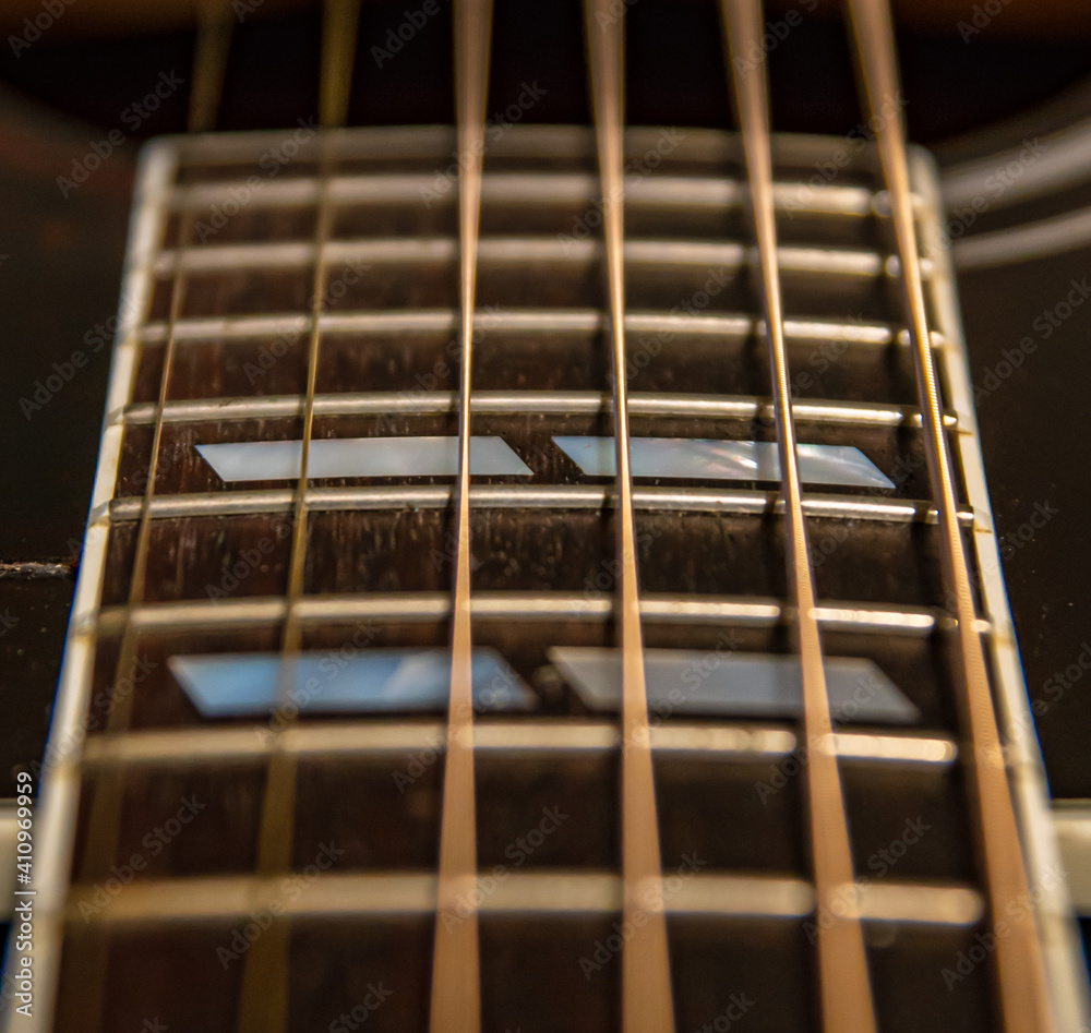 Acoustic Guitar Neck and Fretboard Close Acoustic Guitar Neck and Fretboard Close