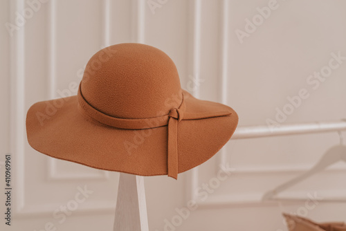 Women's accessories for the autumn season, women's hat lay on a white background