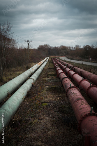 old oil pipeline in the middle of nature, detrimental effect on the environment, industrial landscape aroun Litvinov and Most, north Czech republic