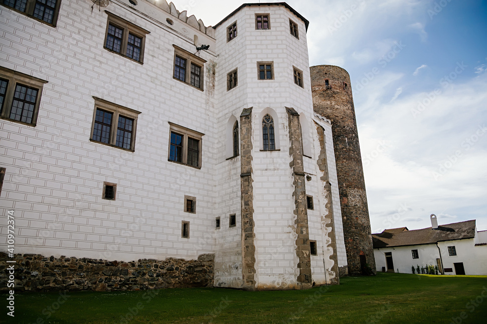 Fototapeta premium Courtyard of medieval castle and chateau, historical palace complex, arcades and white renaissance archs, National cultural landmark, Jindrichuv Hradec, South Bohemia, Czech Republic