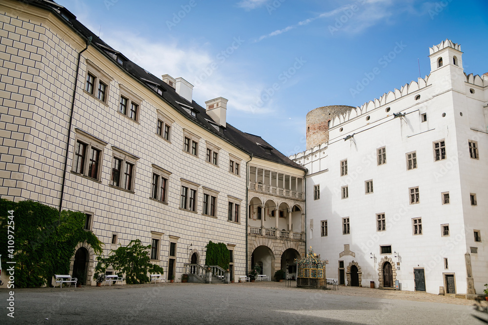 Courtyard of medieval castle and chateau, historical palace complex, arcades and white renaissance archs, National cultural landmark, Jindrichuv Hradec, South Bohemia, Czech Republic