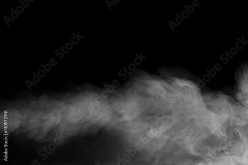 Blur white water vapour on isolated black background. Abstract of steam with copy space. Steam flow. Smoke on white background.