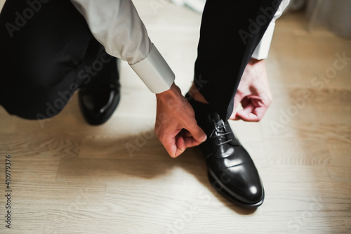 Beautiful man, groom posing and preparing for wedding