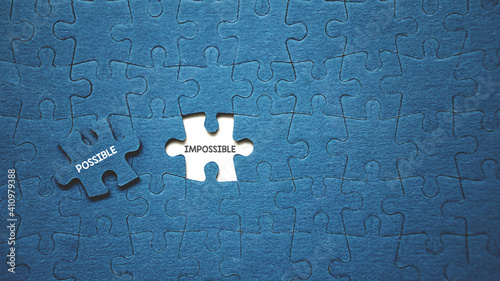 Top view flat lay of jigsaw puzzle with one piece missing .Positive thinking concept .Putting the last piece it can be done.Possible vs impossible