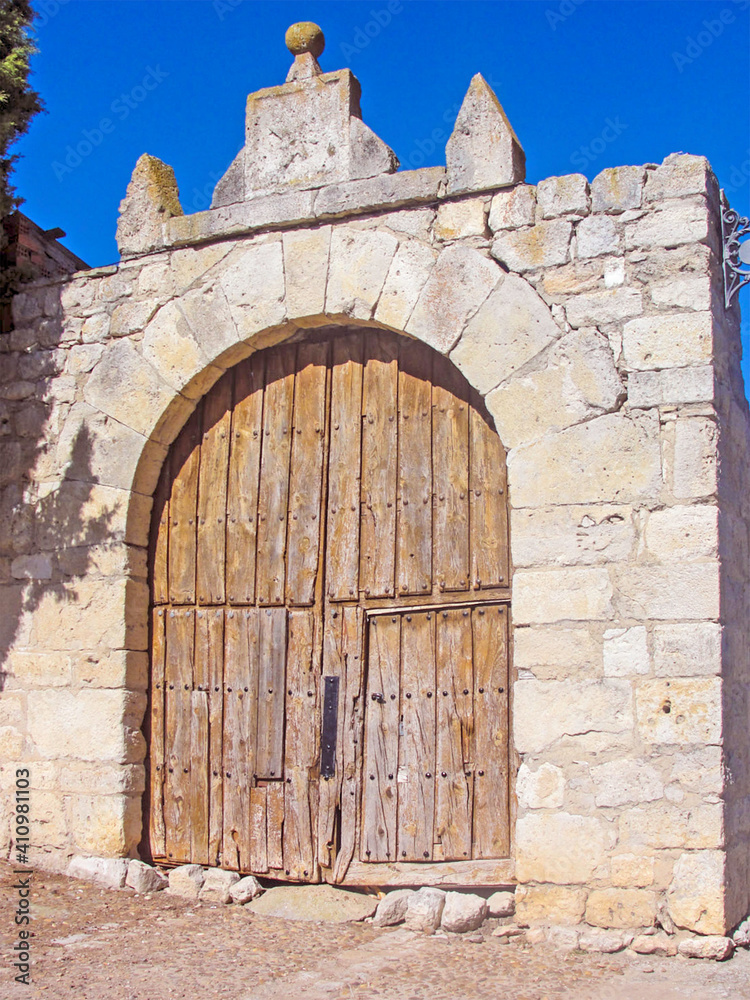 Ancient door of wood that gives access to the entrance of Santa Maria church of Wanba, a village of Valladolid, Spain