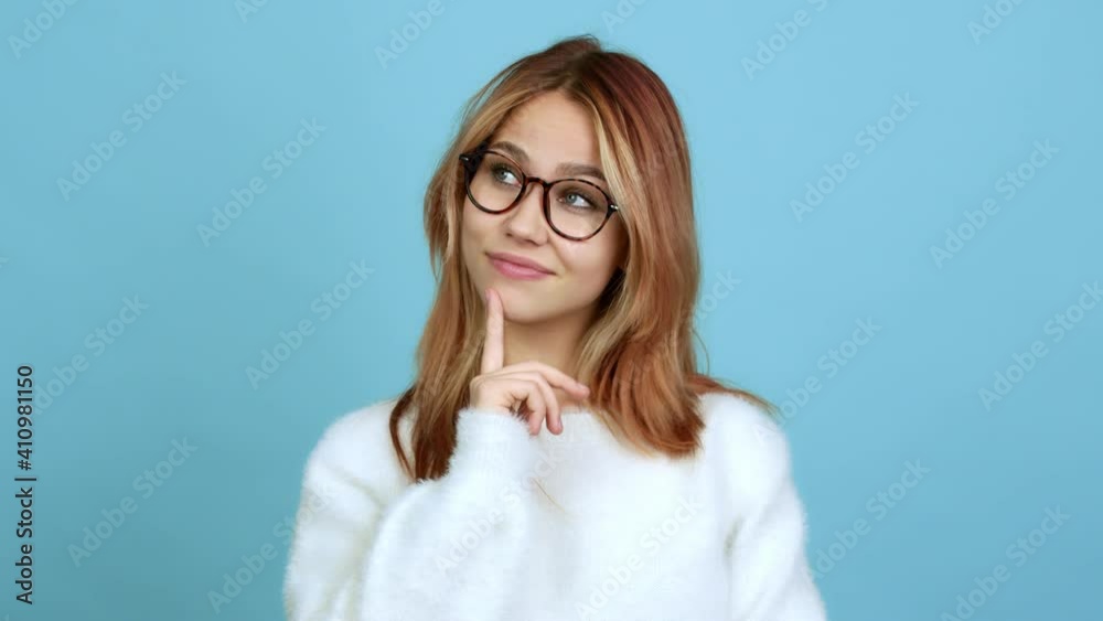 Teenager girl with glasses standing and thinking over isolated background Teenager girl with glasses standing and thinking over isolated background