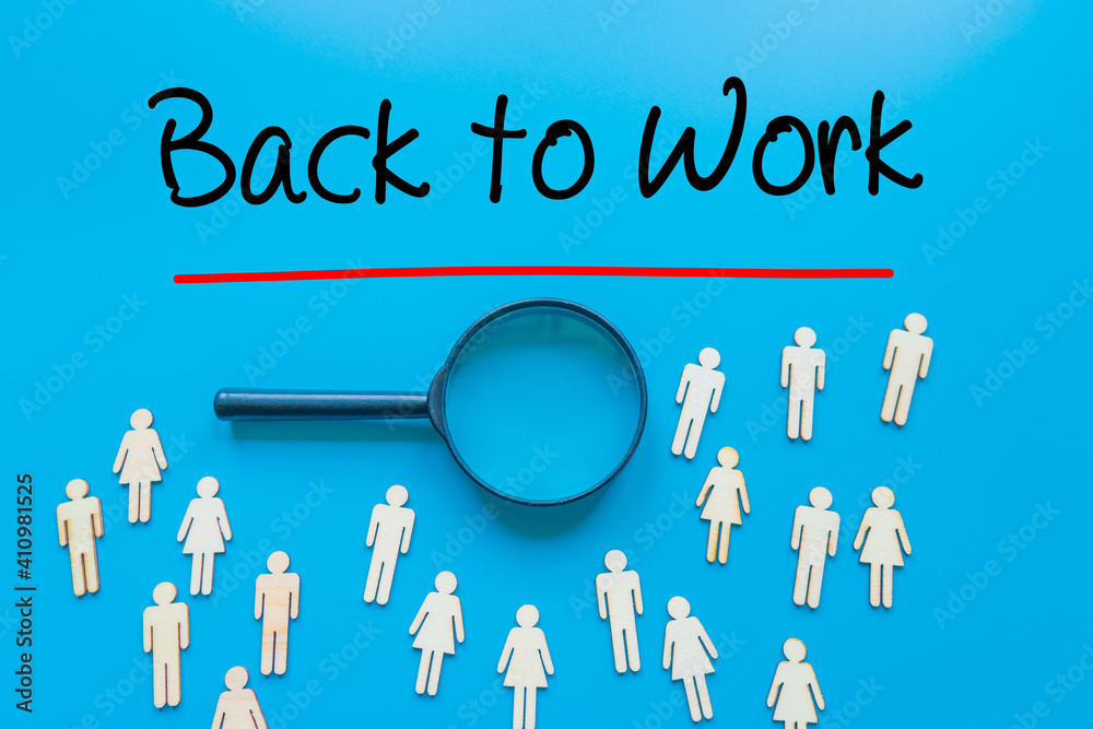 Back to Work Sign on white paper. Man Hand Holding Paper with text. Isolated on Workers concept, Magnifying glass. Blue. Back to Work Sign on white paper. Man Hand Holding Paper with text. Isolated on Workers concept, Magnifying glass. Blue.