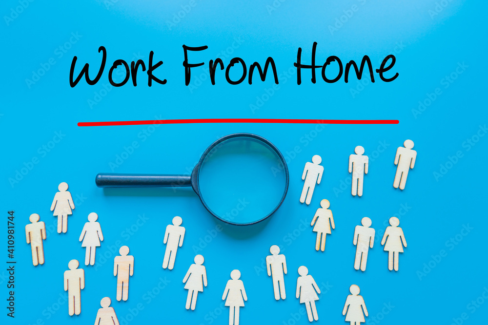 Work From Home Sign on white paper. Man Hand Holding Paper with text. Isolated on Workers concept, Magnifying glass. Blue. Work From Home Sign on white paper. Man Hand Holding Paper with text. Isolated on Workers concept, Magnifying glass. Blue.