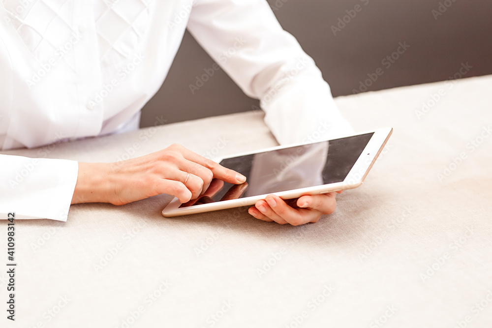Midsection of female doctor using digital tablet Midsection of female doctor using digital tablet