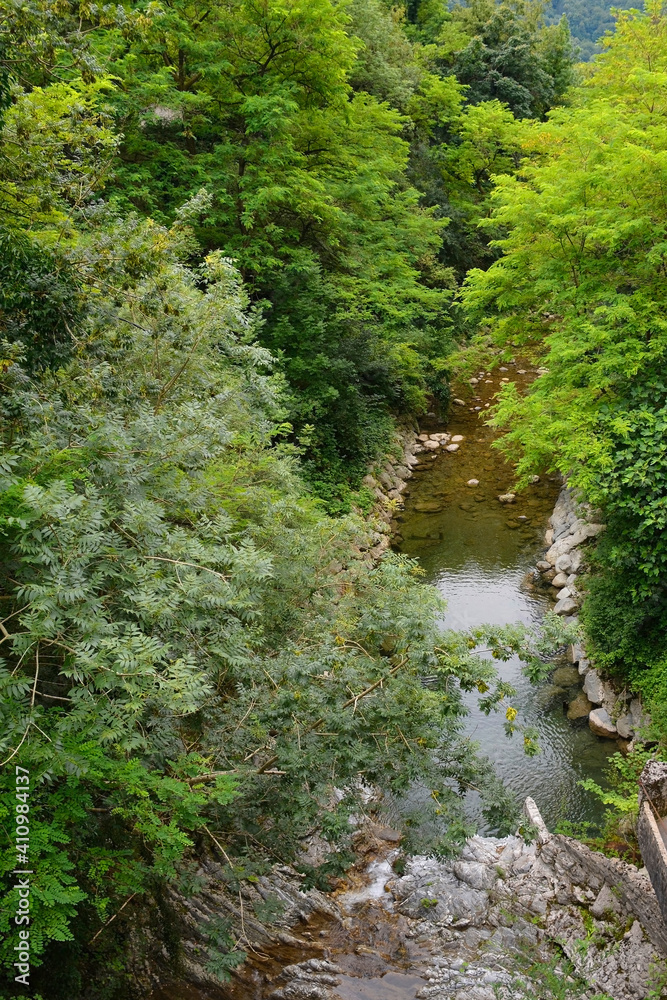 Fototapeta premium The Susica River as it flows through the village of Selisce in the Tolmin municipality of Primorska in Slovenia 