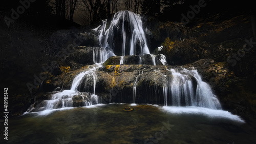 travertine waterfall in the middle of the village Lucky