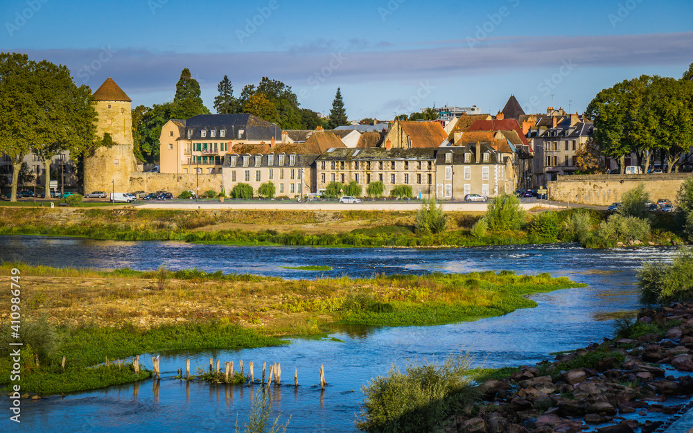View on the Loire riverbanks of the city of Nevers (Burgundy, France) from the Loire river bridge