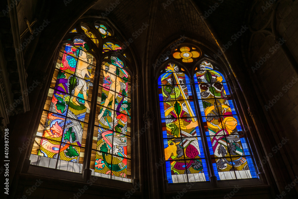 Inside the gothic St Cyr Ste Juliette Cathedral of Nevers, a city located in Burgundy, France. The stained glass windows are modern and were installed after WWII.