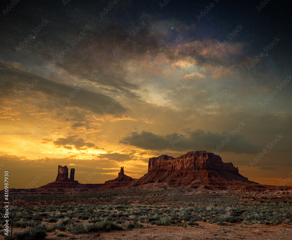 Dramatic twilight sky and majestic sandstone formations in Monument Valley National Park.