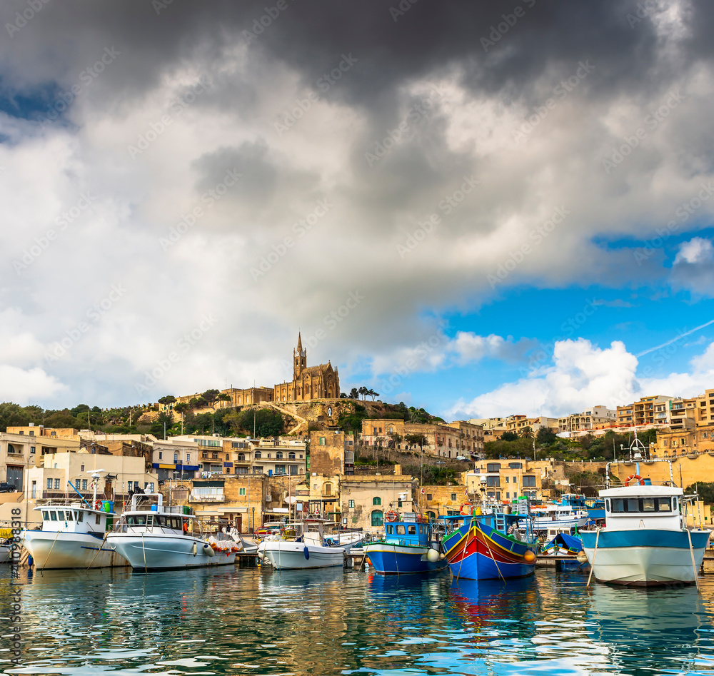 Port of the island of Gozo with its fishing boats, in Malta in the far south of Europe