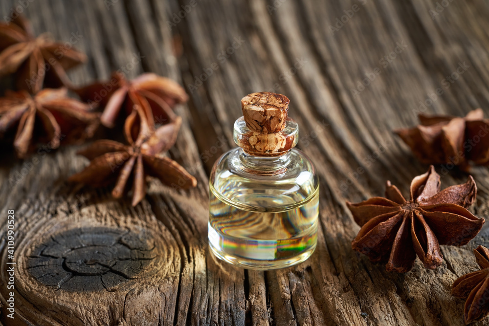 Essential oil bottle with star anise Essential oil bottle with star anise