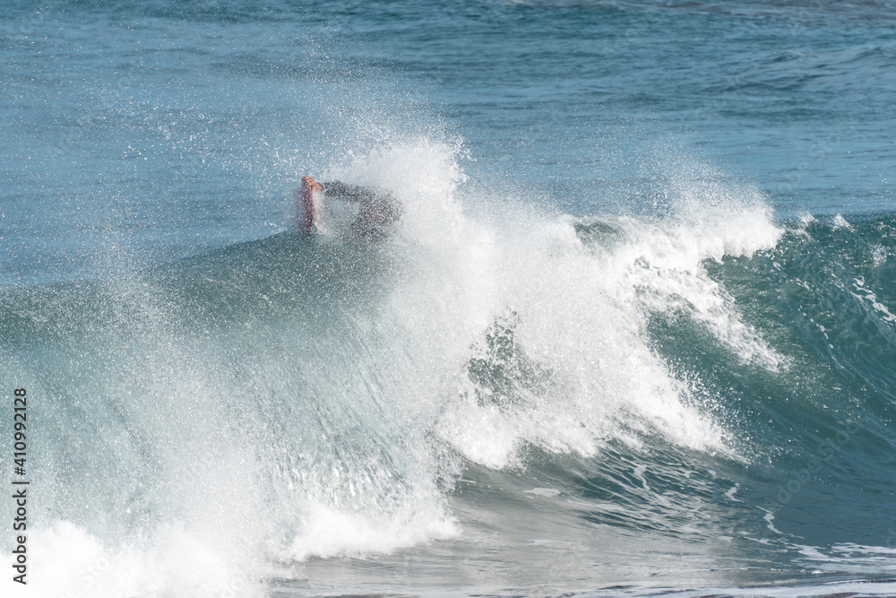 Bodyboarder in action on the ocean waves on the last hours of the  day in Gran Canaria. Canary islands