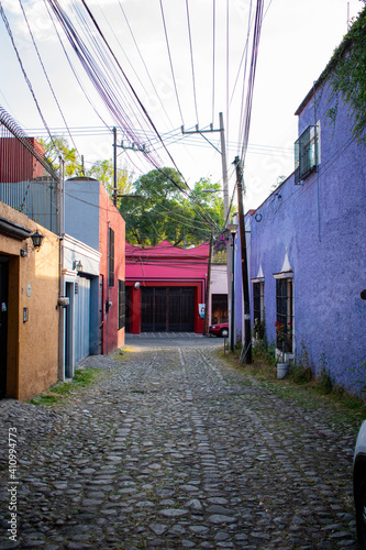 Colorful Hispanic houses in alley from Mexico City photo