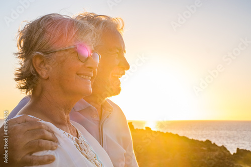 Canvas Print couple of two cute seniors together enjoying summer and having fun at the beach